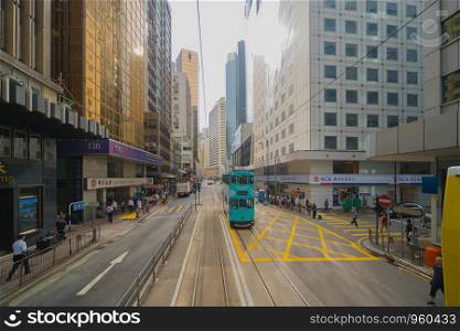 Tram or bus view. Crowd of people on street of Central district. Transportation for tourists visiting the urban city in travel trip or holiday. Fast speed at Hong Kong Downtown, China