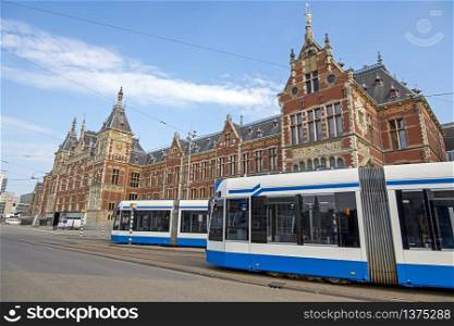 Trams at the central station in Amsterdam Netherlands