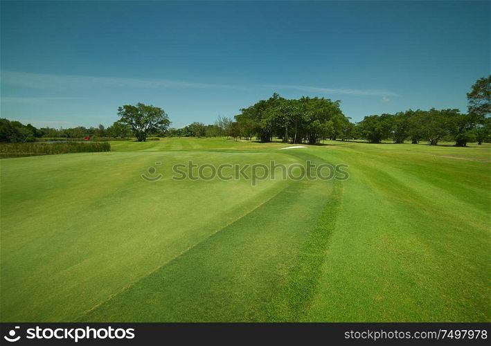Tranquil and clean green beautiful golf field .