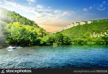 Tranquil backwater in mountains in sunny morning
