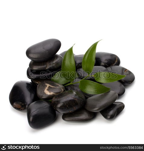 Tranquil scene. Green leaf and stones isolated on white background.