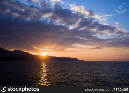 Tranquil sunset on Costa del Sol at the Mediterranean Sea in Spain, Andalucia region, Malaga province.