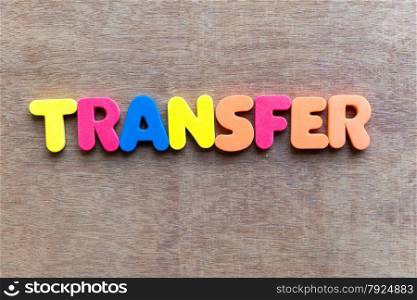 transfer colorful word in the wooden background