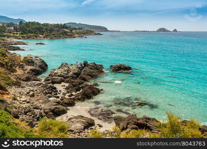 Translucent turqouise sea, rocky coastline and beach near to Ile Rousse in the Balagne region of Corsica