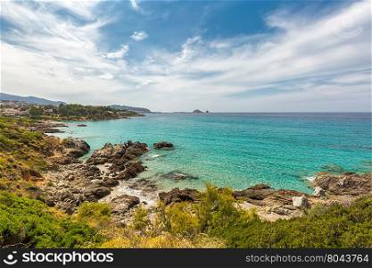 Translucent turqouise sea, rocky coastline and beach near to Ile Rousse in the Balagne region of Corsica