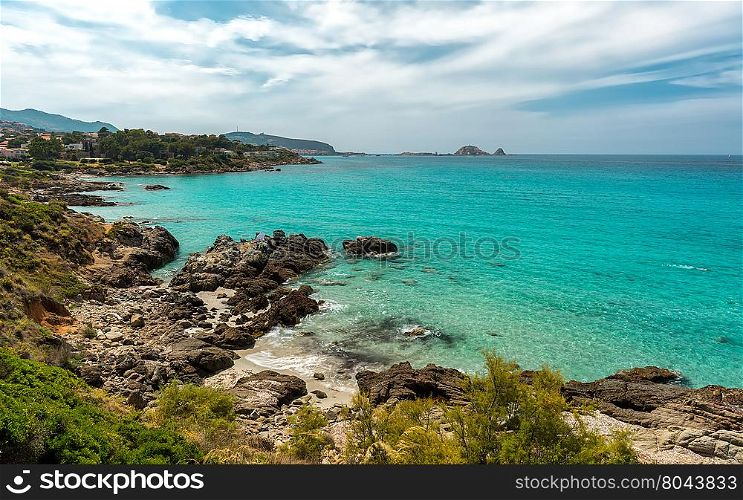 Translucent turqouise sea, rocky coastline and beach near to Ile Rousse in the Balagne region of Corsica