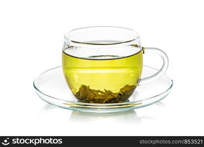 Transparent glass cup of natural green tea isolated on a white background in close-up