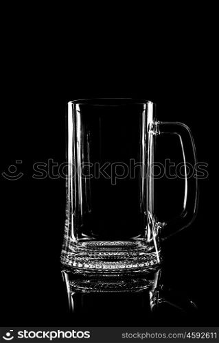 transparent glass for beer on black background with reflection