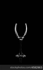 transparent glass for wine on black background with reflection