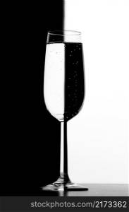 Transparent Glass with liquid on black and white background. Transparent Glass with liquid