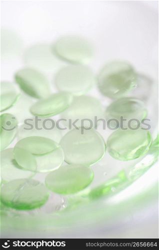 Transparent green marble pebbles