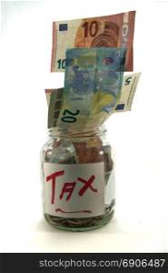 transparent jar containing money for taxes . transparent jar containing money for taxes on a white background