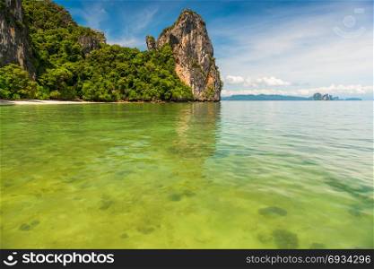 transparent sea water, view of the coral in a beautiful bay with high cliffs, Thailand, Krabi