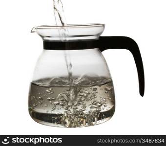 Transparent teapot with hot tea in backlit isolated on a white background