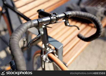 transport and vehicle concept - close up of fixed gear bicycle on street. close up of fixed gear bicycle on street