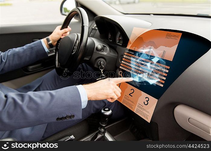 transport, business, modern technology and people concept - close up of man driving car and pointing finger to chart and low poly shape on board computer screen