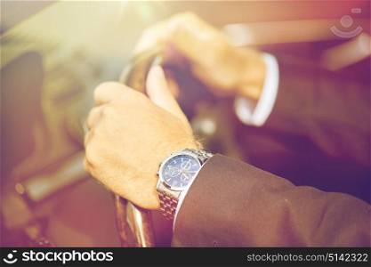 transport, business, time and people concept - senior businessman hands with wristwatch driving car. senior businessman hands driving car