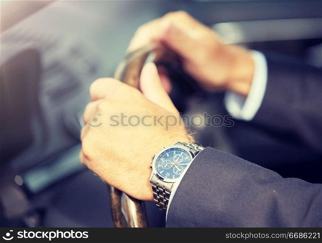 transport, business, time and people concept - senior businessman hands with wristwatch driving car. senior businessman hands driving car