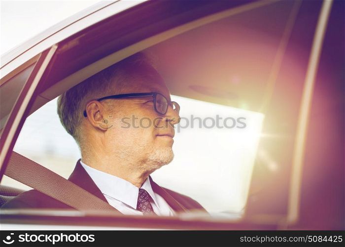 transport, business trip and people concept - senior businessman driving on car back seat. senior businessman driving on car back seat. senior businessman driving on car back seat