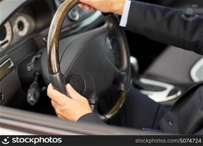 transport, business trip and people concept - senior businessman hands driving car. senior businessman hands driving car