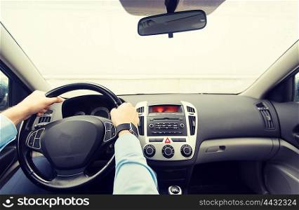 transport, business trip, destination and people concept - close up of young man driving on car parking