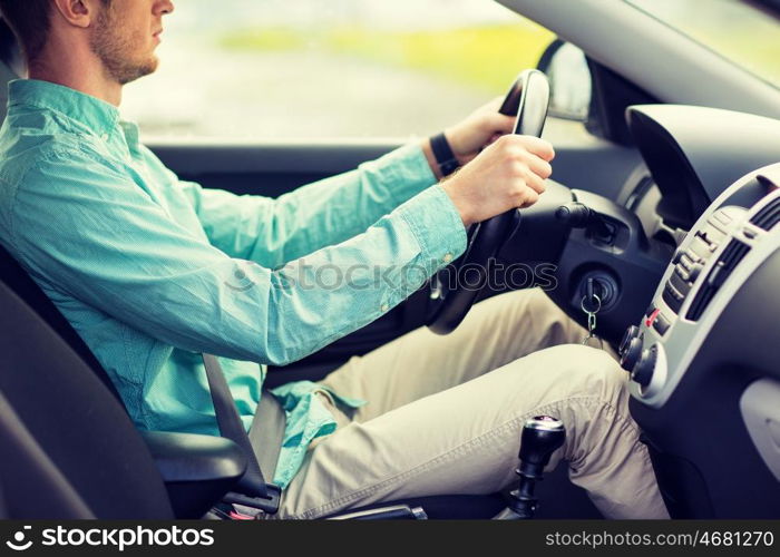 transport, business trip, destination and people concept - close up of young man driving car