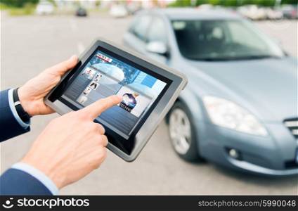 transport, business trip, mass media, technology and people concept - close up of male hands with news on tablet pc computer screen and car outdoors