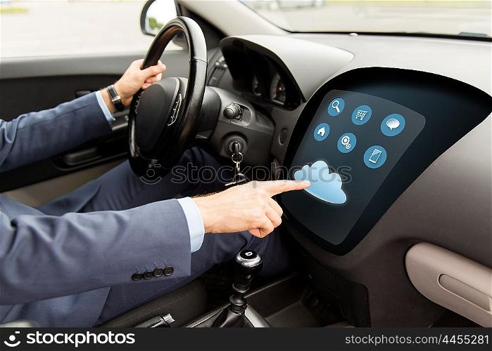 transport, business trip, modern technology and people concept - close up of man driving car with menu on board computer screen and cloud icon