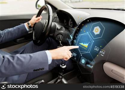 transport, business trip, modern technology and people concept - close up of man driving car and pointing finger to diagram on board computer screen