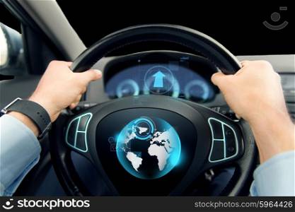 transport, business trip, navigation and people concept - close up of male hands holding car wheel and driving with globe on board computer screen