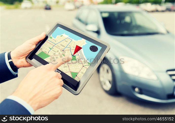 transport, business trip, navigation, technology and people concept - close up of male hands with gps navigator on tablet pc computer and car outdoors