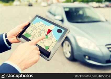 transport, business trip, navigation, technology and people concept - close up of male hands with gps navigator on tablet pc computer and car outdoors