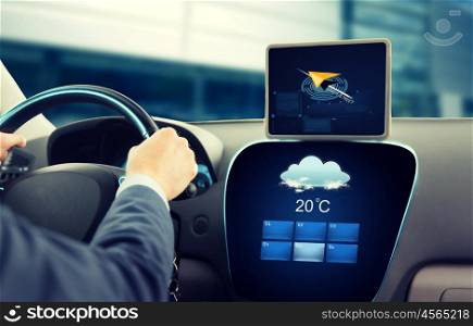 transport, business trip, technology and people concept - close up of businessman driving car with navigator on tablet pc and on board computer showing weather forecast