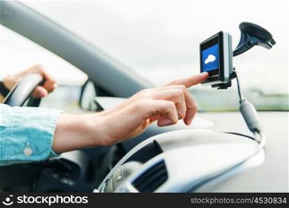 transport, business trip, technology and people concept - close up of male hand pointing to gadget screen and driving car