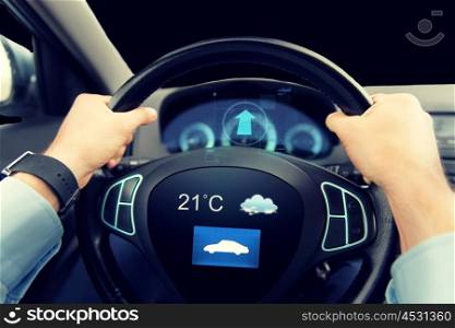 transport, business trip, technology and people concept - close up of male hands holding car wheel and driving with weather sensor on board computer screen