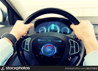 transport, business trip, technology and people concept - close up of male hands holding car wheel and driving with volume level icon on board computer screen