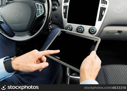 transport, business trip, technology and people concept - close up of male hands holding tablet pc computer with black blank screen in car