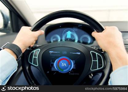 transport, business trip, technology and people concept - close up of male hands holding car wheel and driving with volume level icon on board computer screen