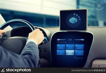 transport, business trip, technology and people concept - close up of young man with tablet pc computer driving car and using eco system mode