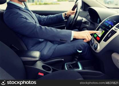 transport, business trip, technology and people concept - close up of young man in suit driving car and receiving incoming call from woman on board computer screen