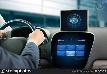 transport, business trip, technology and people concept - close up of young man with tablet pc computer driving car and using eco system mode