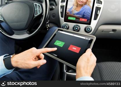 transport, business trip, technology, communication and people concept - close up of male hands holding tablet pc computer with incoming call on screen in car