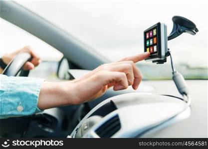 transport, business trip, technology, media and people concept - close up of male hand with menu icons on gadget screen driving car