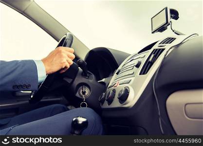 transport, business trip, technology, navigation and people concept - close up of male hand using gps navigator while driving driving car