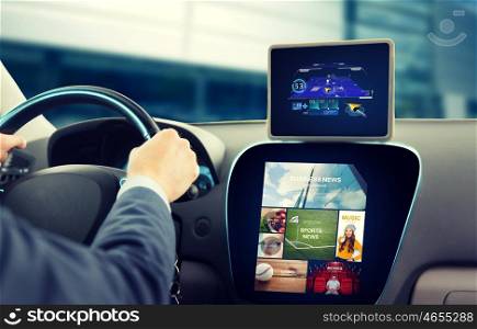 transport, business trip, technology, navigation and people concept - close up of young man with gps navigator on tablet pc and on-board computer menu driving car