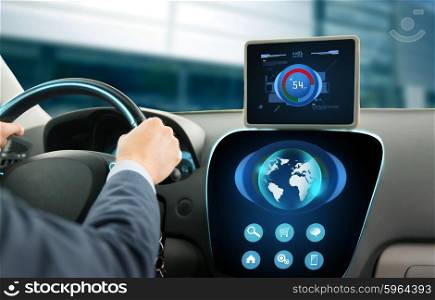 transport, business trip, technology, navigation and people concept - close up of businessman with tablet pc and globe on computer driving car