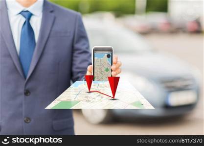 transport, business trip, technology, navigation and people concept - close up of man showing smartphone gps navigator map on screen on car parking