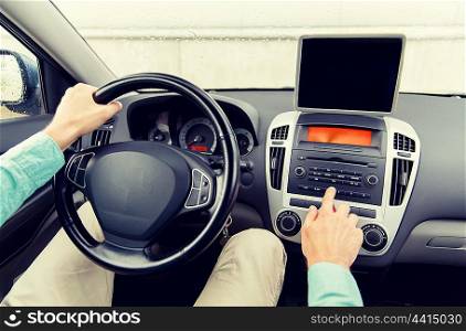 transport, business trip, technology, navigation and people concept -close up of young man with tablet pc computer driving car