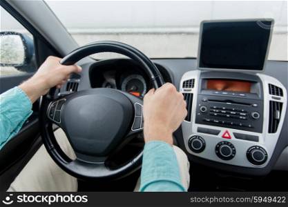 transport, business trip, technology, navigation and people concept -close up of young man with tablet pc computer driving on car parking