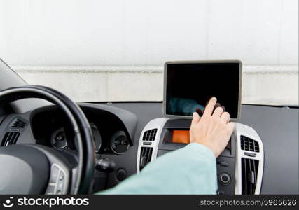 transport, business trip, technology, navigation and people concept -close up of young man with tablet pc computer driving car